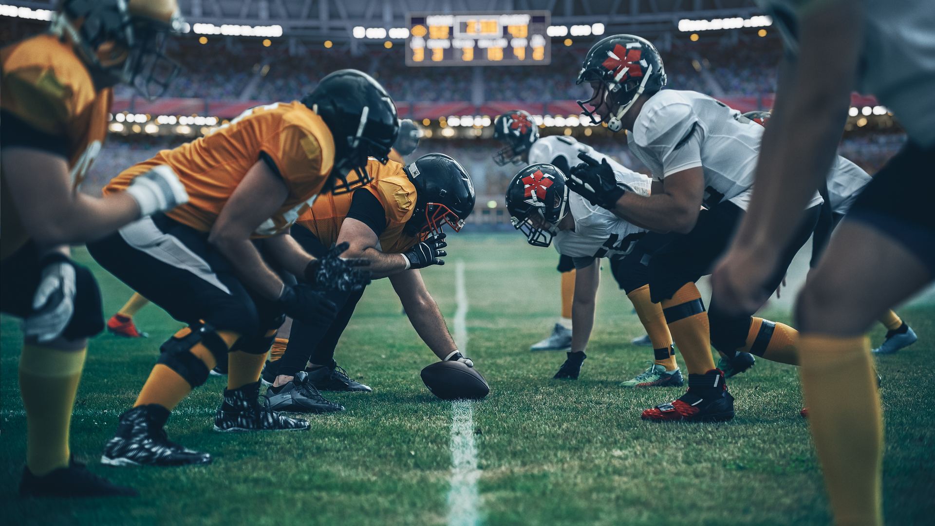 High school football linemen at the snap